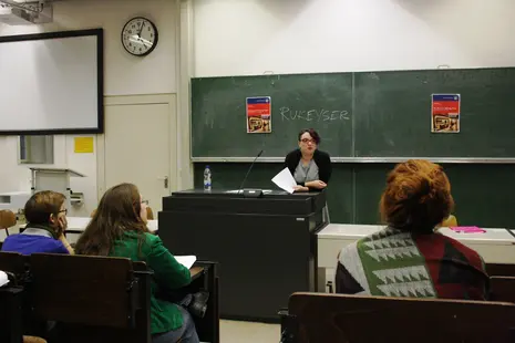 Impressions of Laura Passin giving her talk and attendees listening to her.